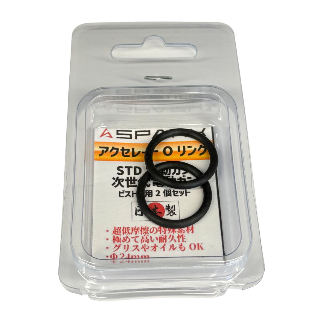 A clear blister pack containing two black SPARK Accelerate O-rings for airsoft pistons on a white card with Japanese text.
