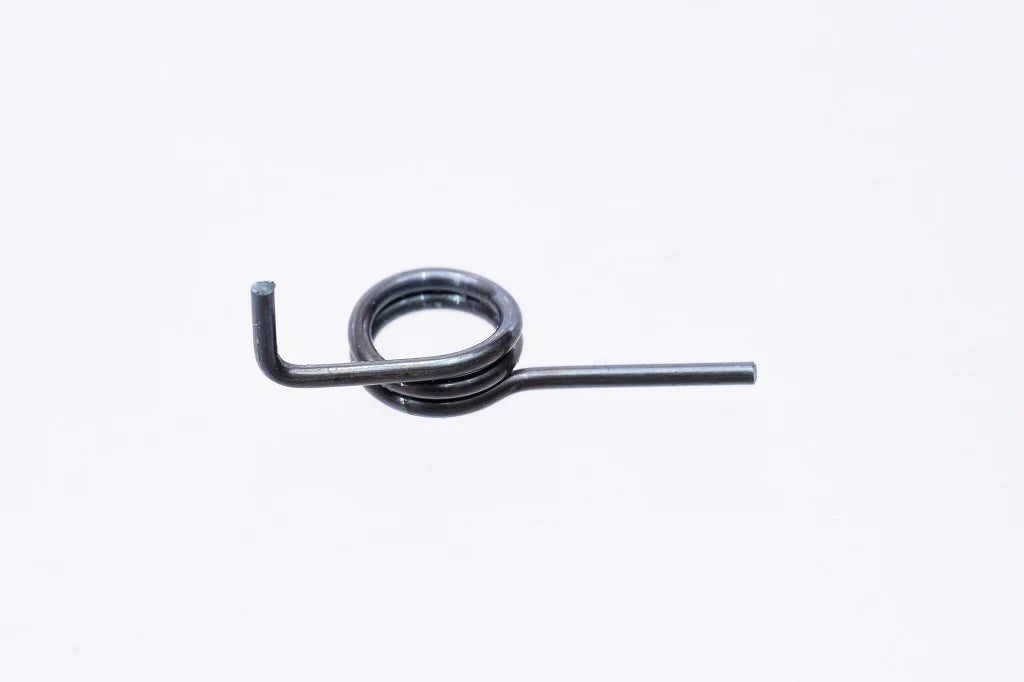 Detailed macro photograph highlighting the specific angle bend and tension coil loop of the SPARK Standard Trigger Spring by AIRSOFT97.